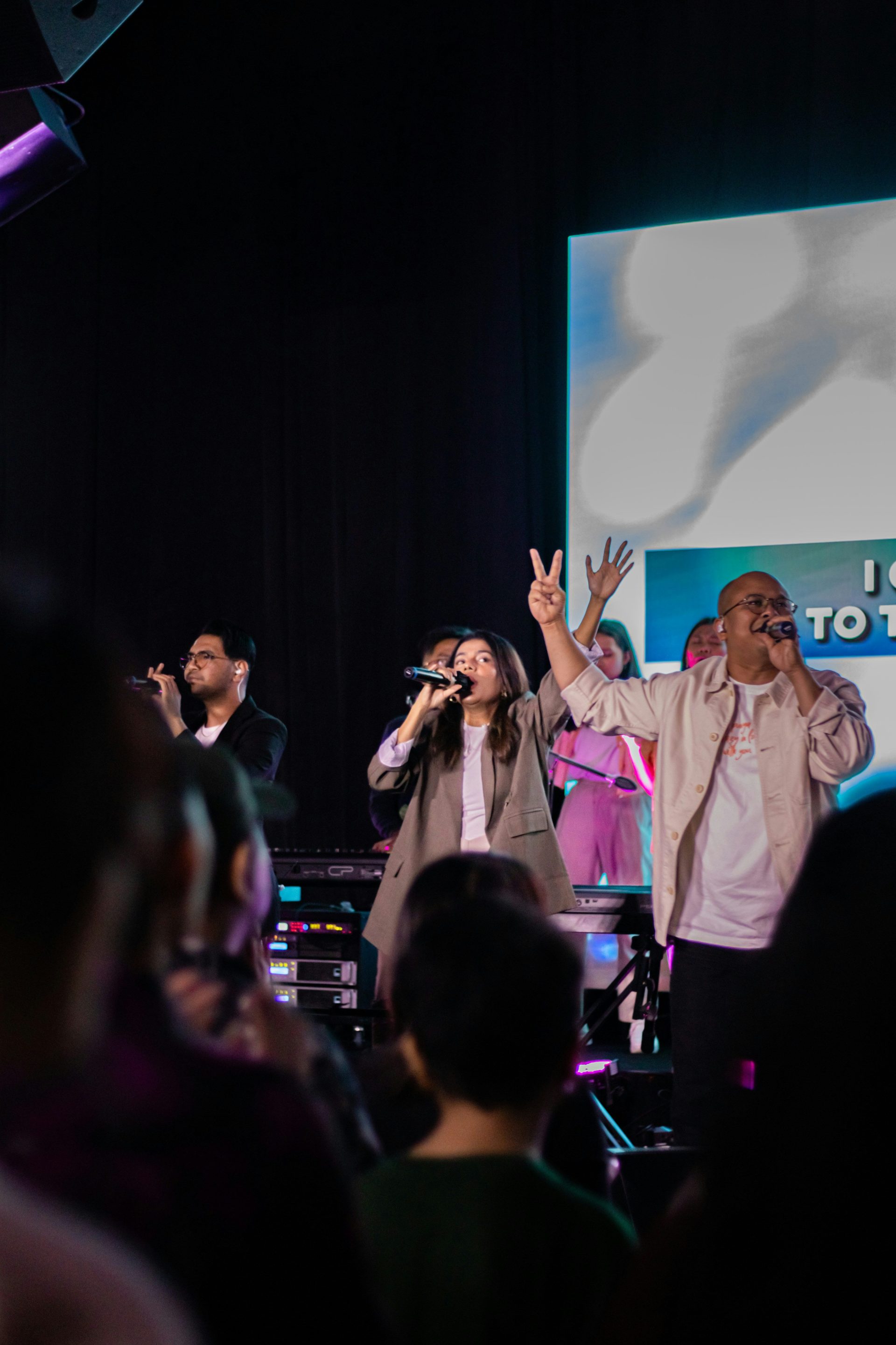 A group of people standing on top of a stage